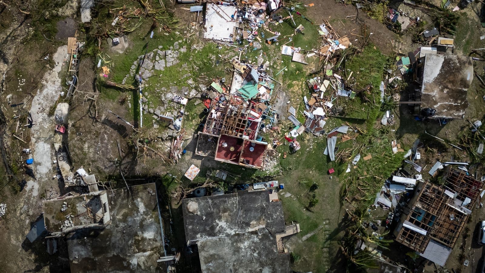 Aerial view of homes with hurricane roof damage