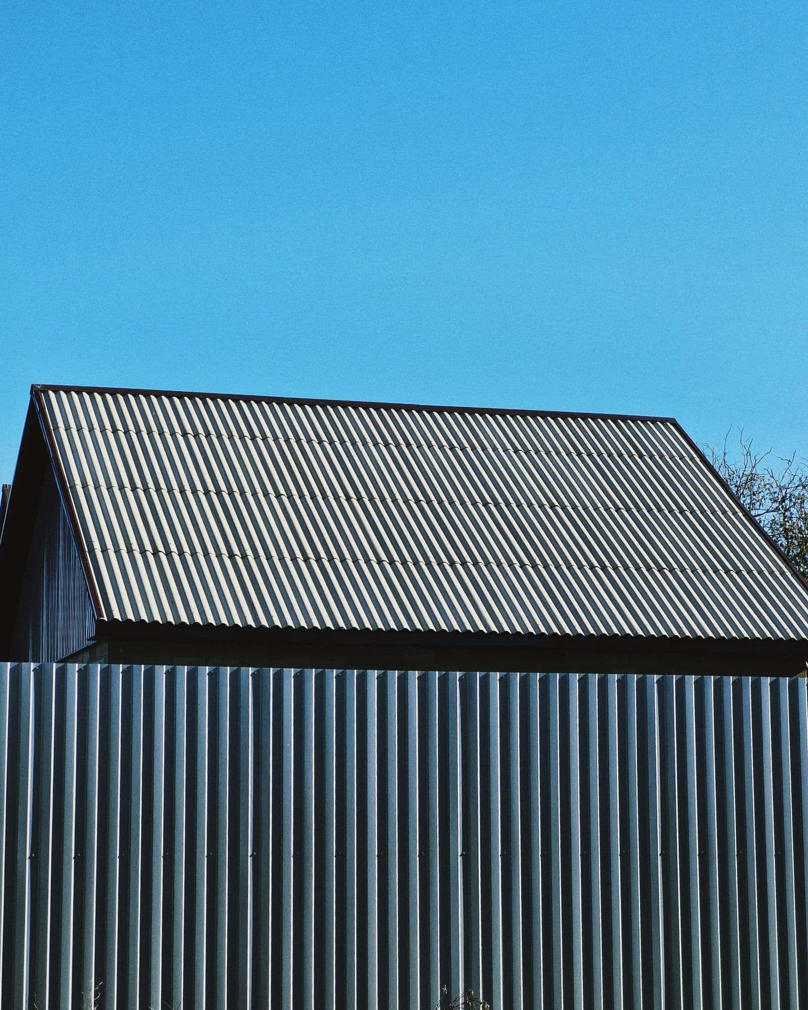 Metal roof panels against a blue sky