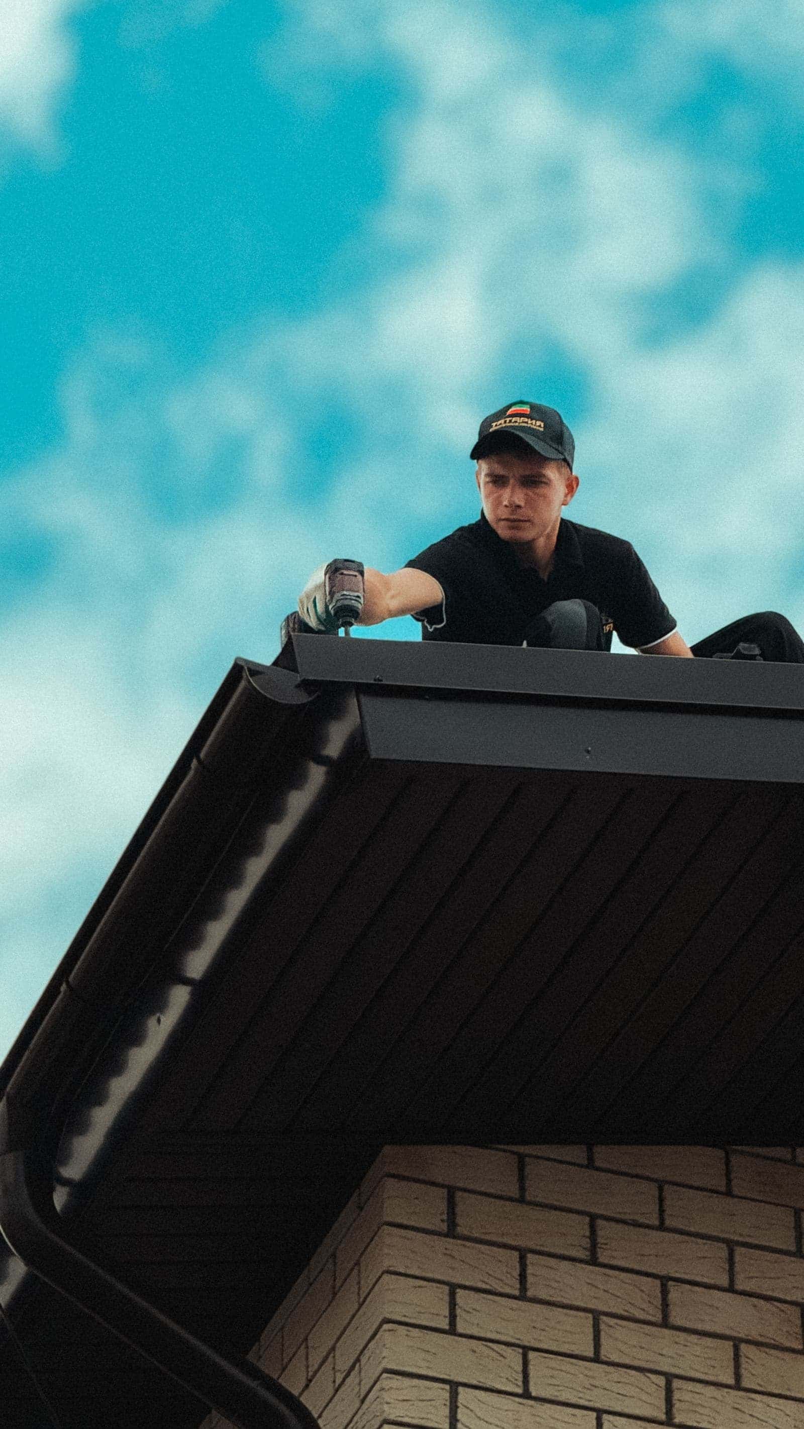 Roofer working near roof vents