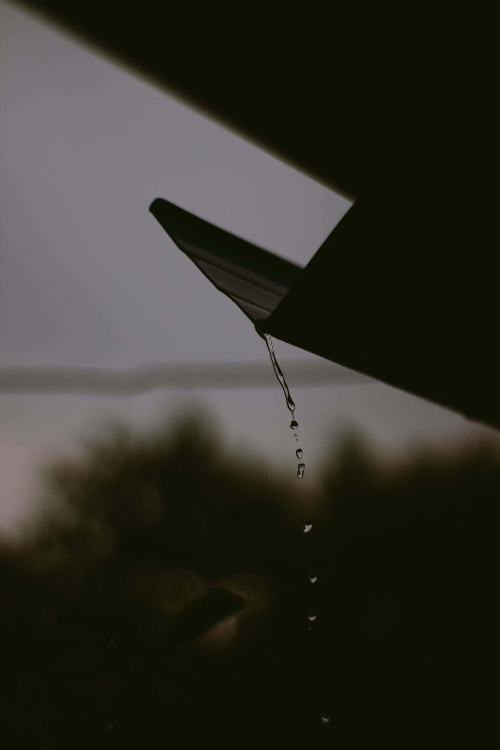 Water overflowing a roof edge